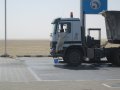  Big truck, small man.