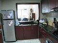  Kitchen - bar with living room behind